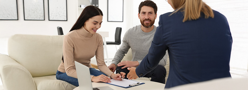 Couple discussing property matters with our conveyancer — showcasing the approachable and expert conveyancing service clients can expect when contacting Reliance Conveyancing.